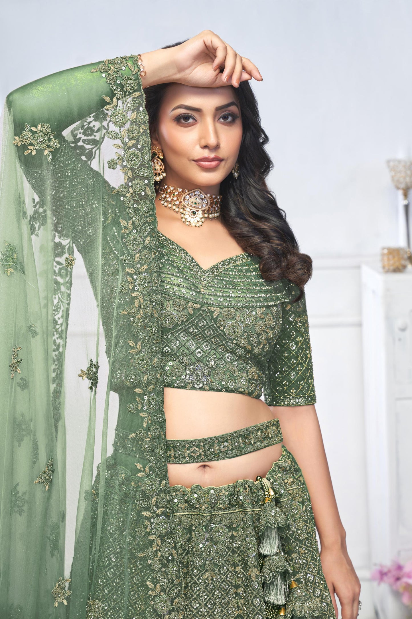 Green Heavy Sequins & Zari Embroidered Soft Net Bridal Wear Lehenga
