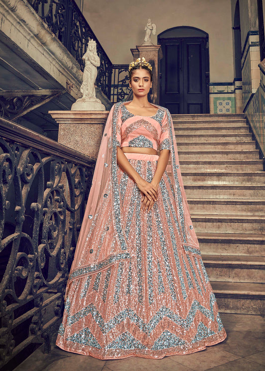 Ravishing Peach Color Net Lehenga Choli