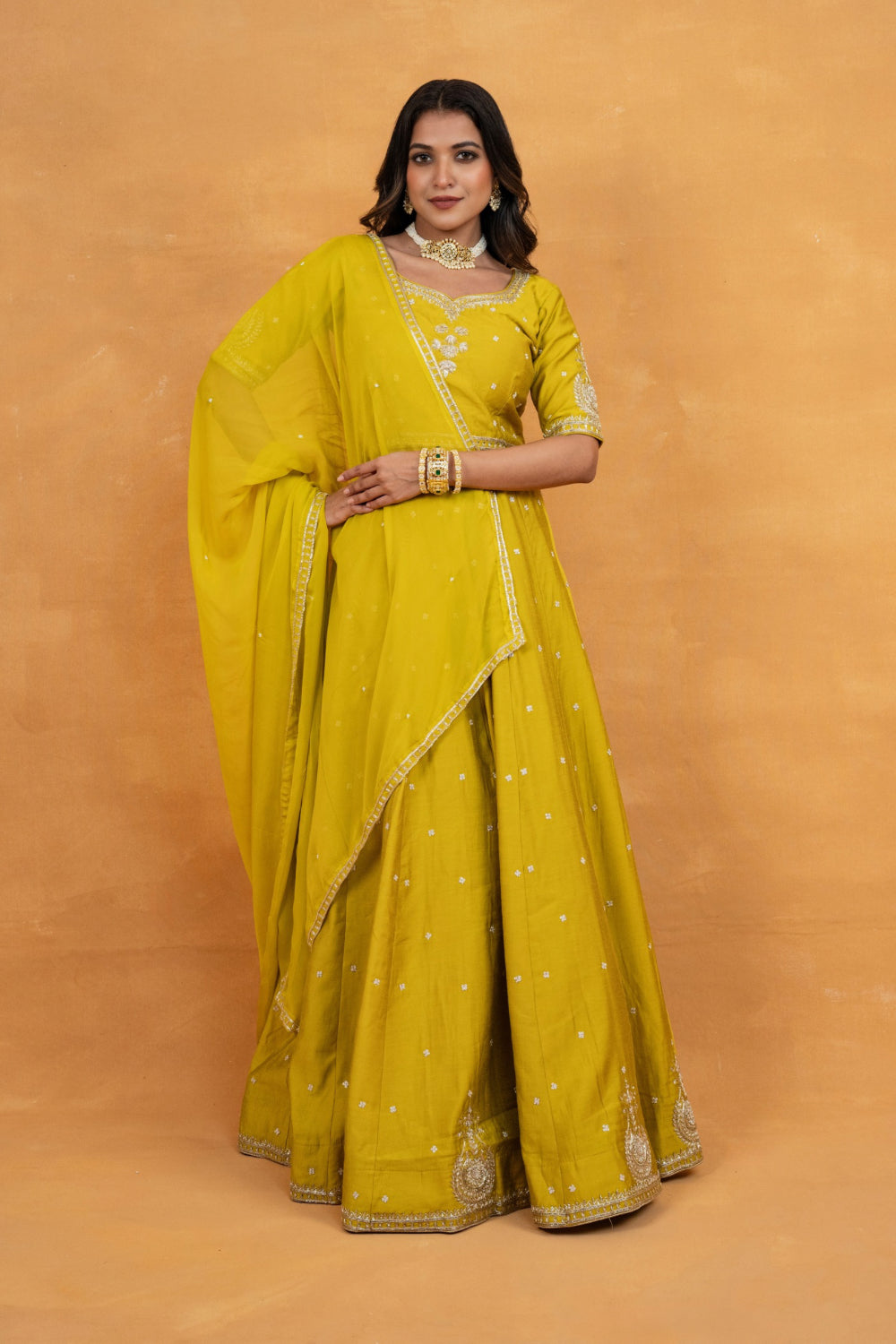 Mustard yellow soft silk zardozi embroidered lehenga choli with hand cut dana and sequin work