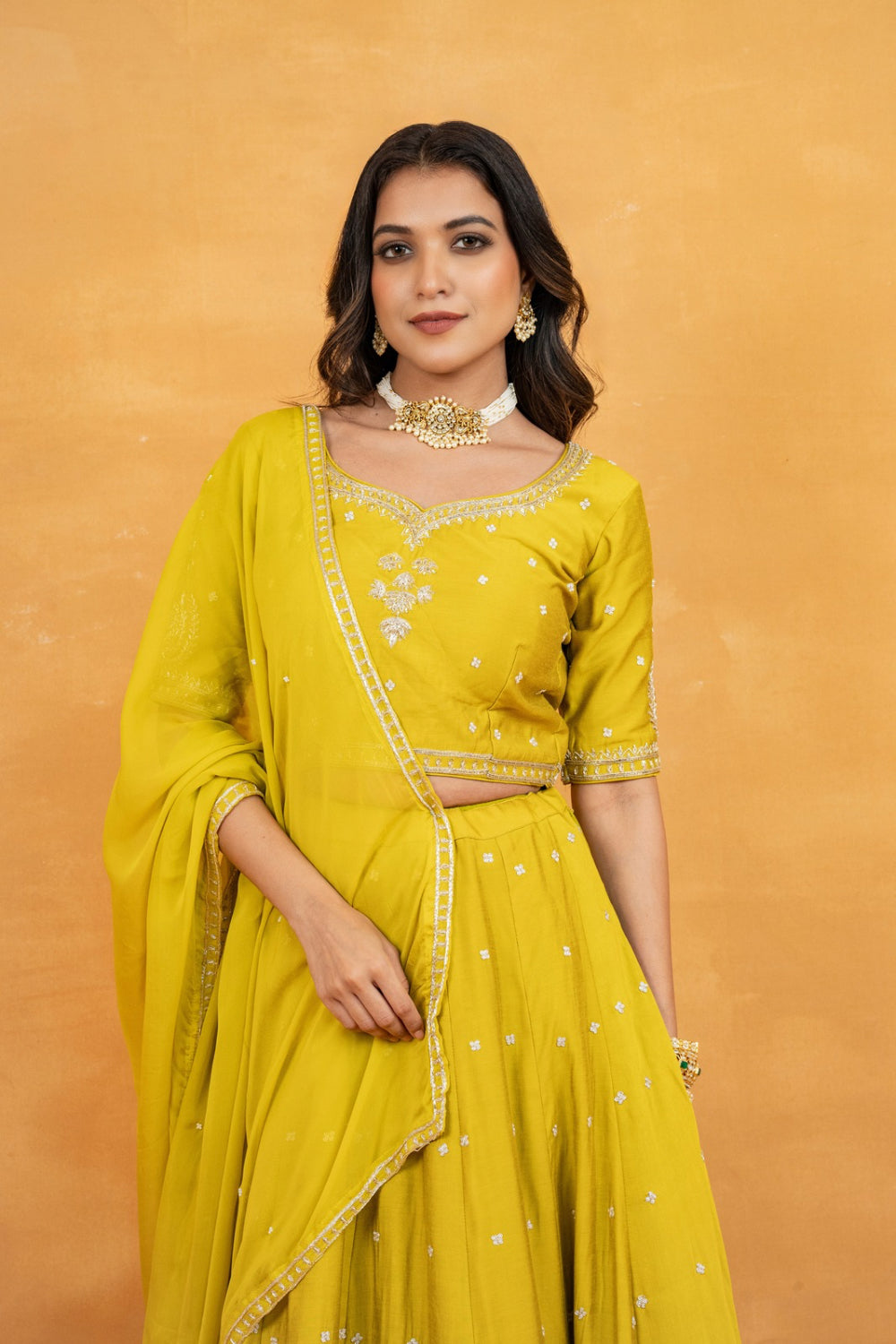Mustard yellow soft silk zardozi embroidered lehenga choli with hand cut dana and sequin work