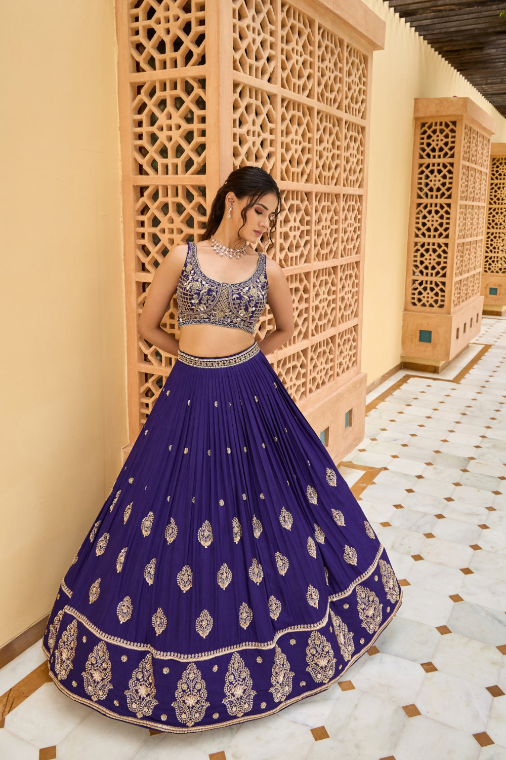 Navy blue silk lehenga choli with golden thread embroidery and sequins work