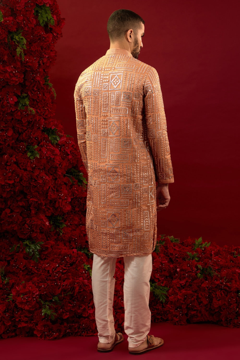 Orange silk kurta set with hand and machine work