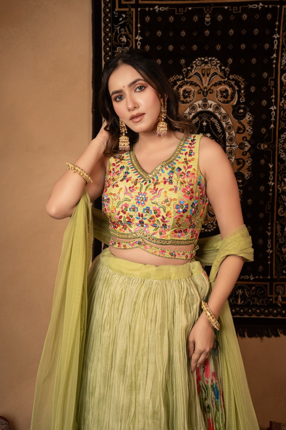 Tea green georgette lehenga choli with resham and mirror work