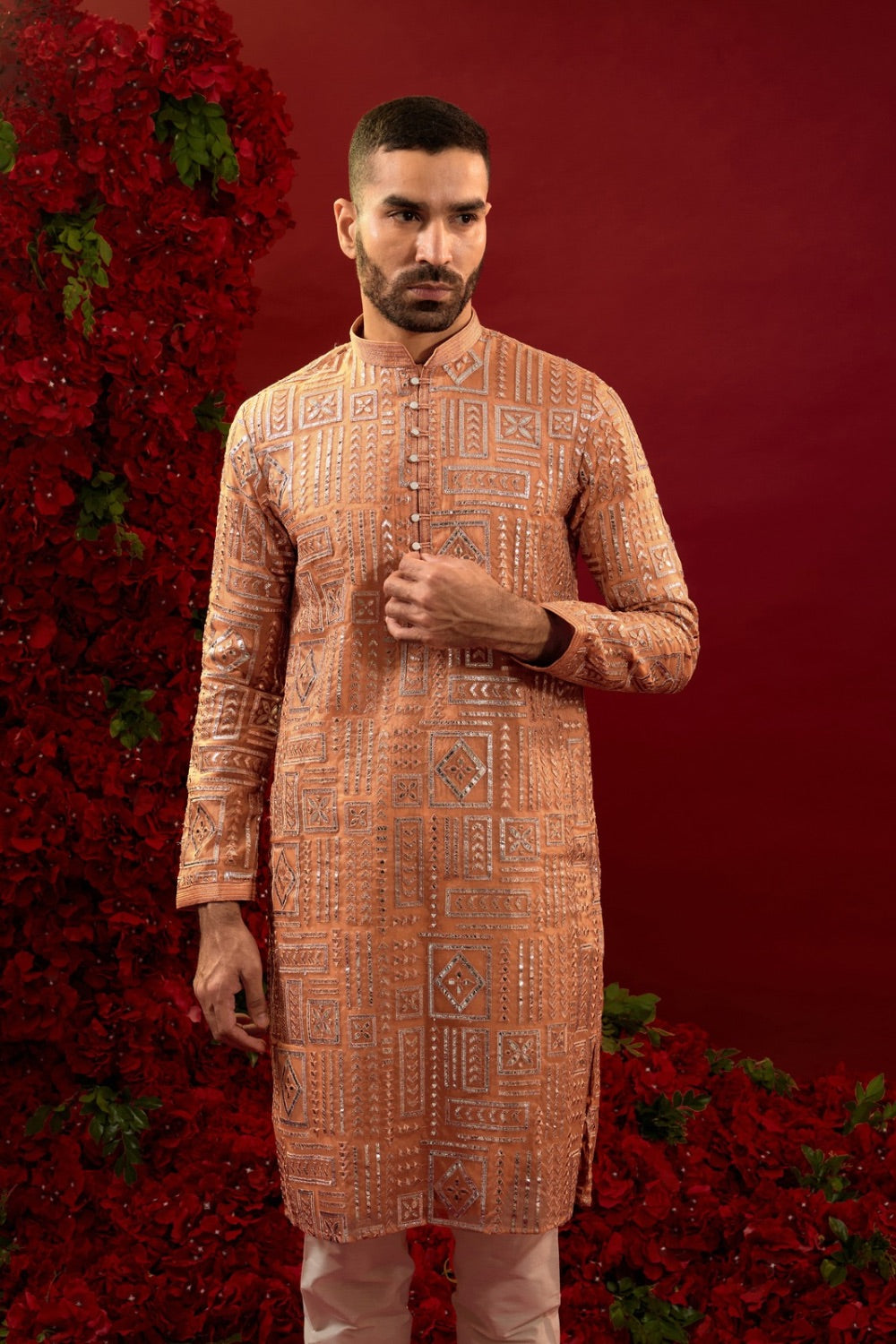 Orange silk kurta set with hand and machine work
