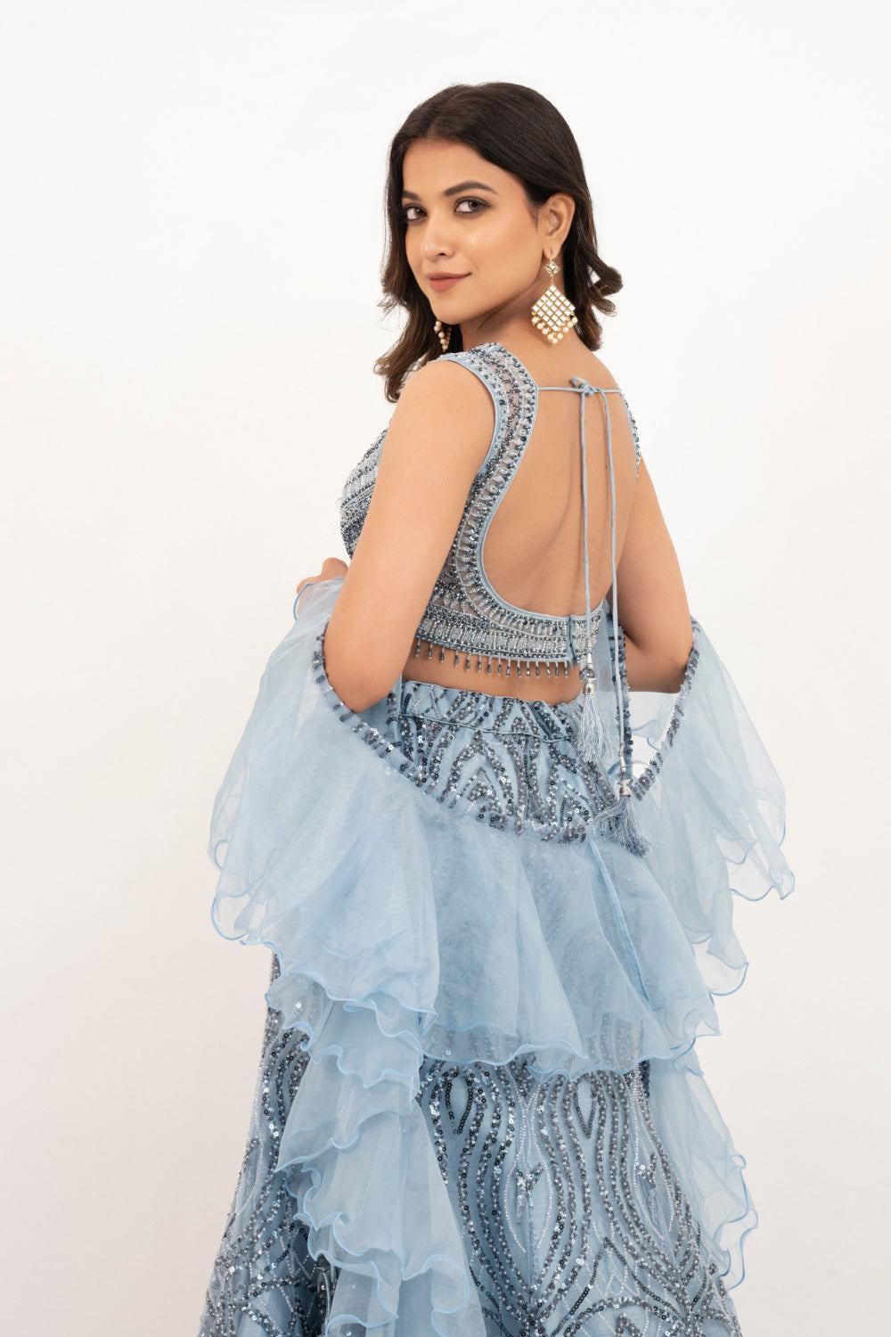 Powder Blue net lehenga choli with Sequins and hand cut dana work