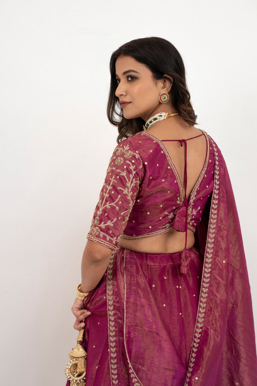 Magenta tissue silk zardozi embroidered lehenga choli with hand cut dana and beads work