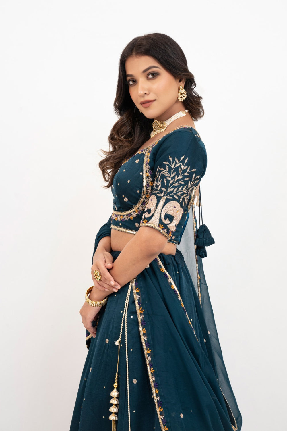 Peacock blue soft silk zardozi embroidered lehenga choli with hand cut dana work