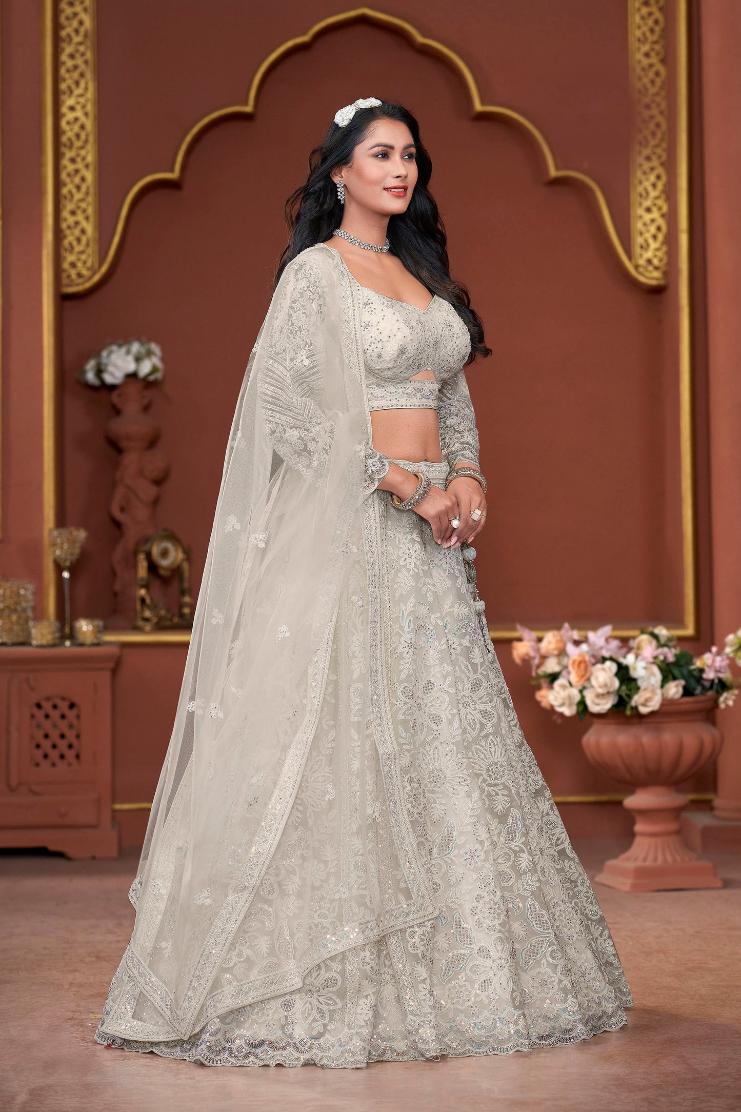 Off White Heavy Zarkan Embroidery Net Wedding Lehenga