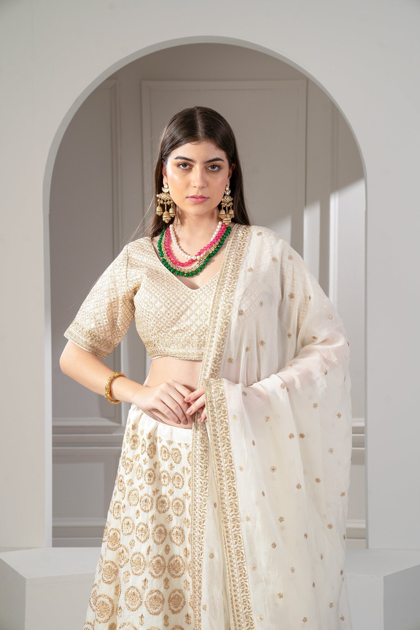 Metallic Gold Organza Silk Sequinned Lehenga Set.