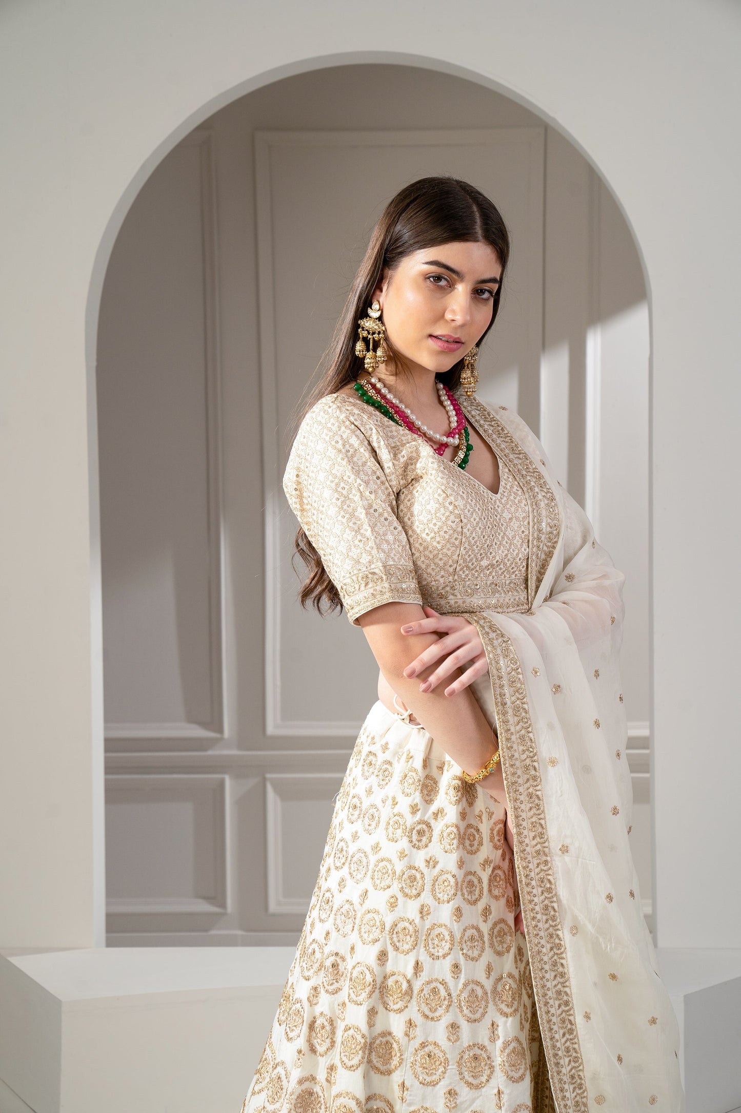 Metallic Gold Organza Silk Sequinned Lehenga Set.