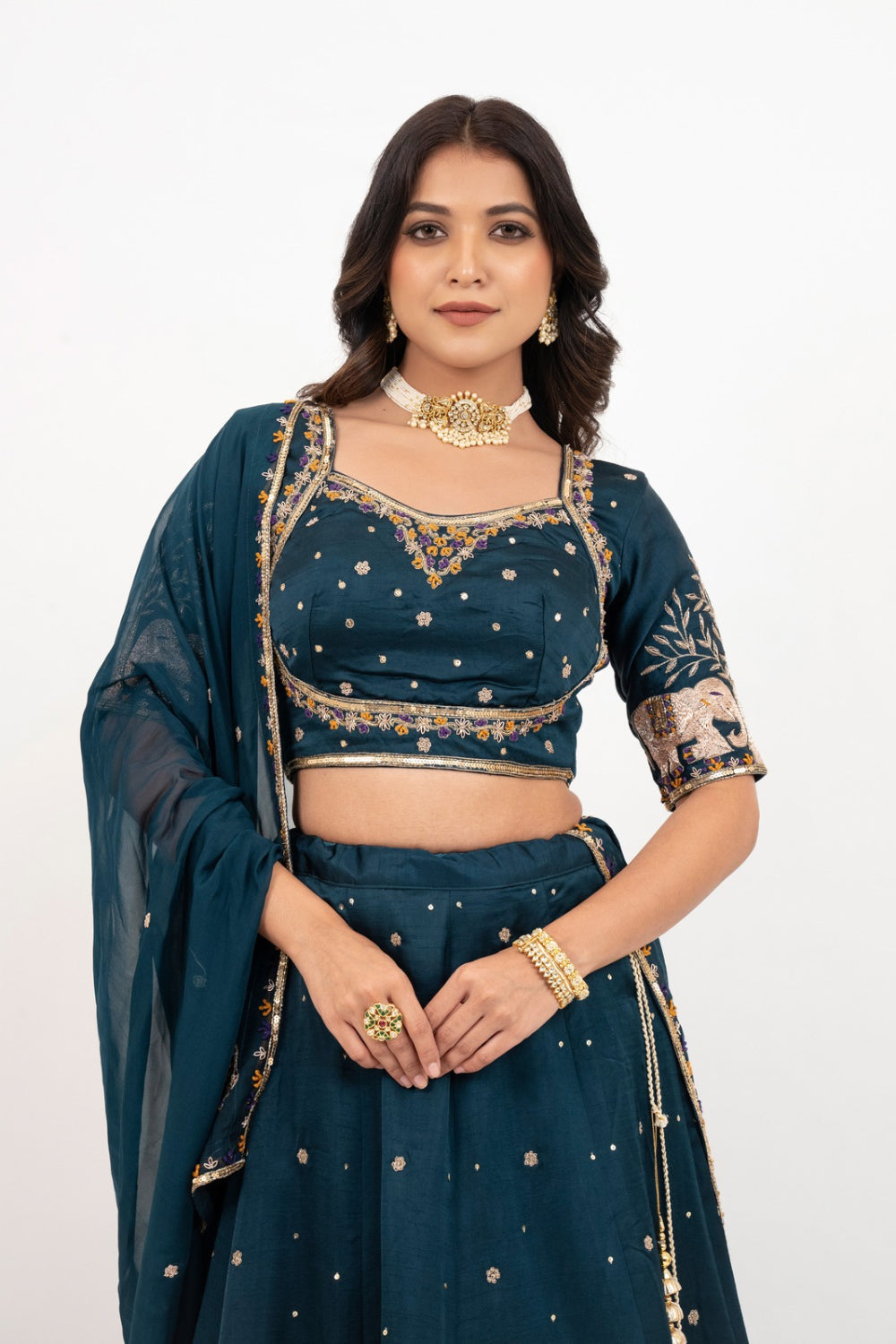 Peacock blue soft silk zardozi embroidered lehenga choli with hand cut dana work
