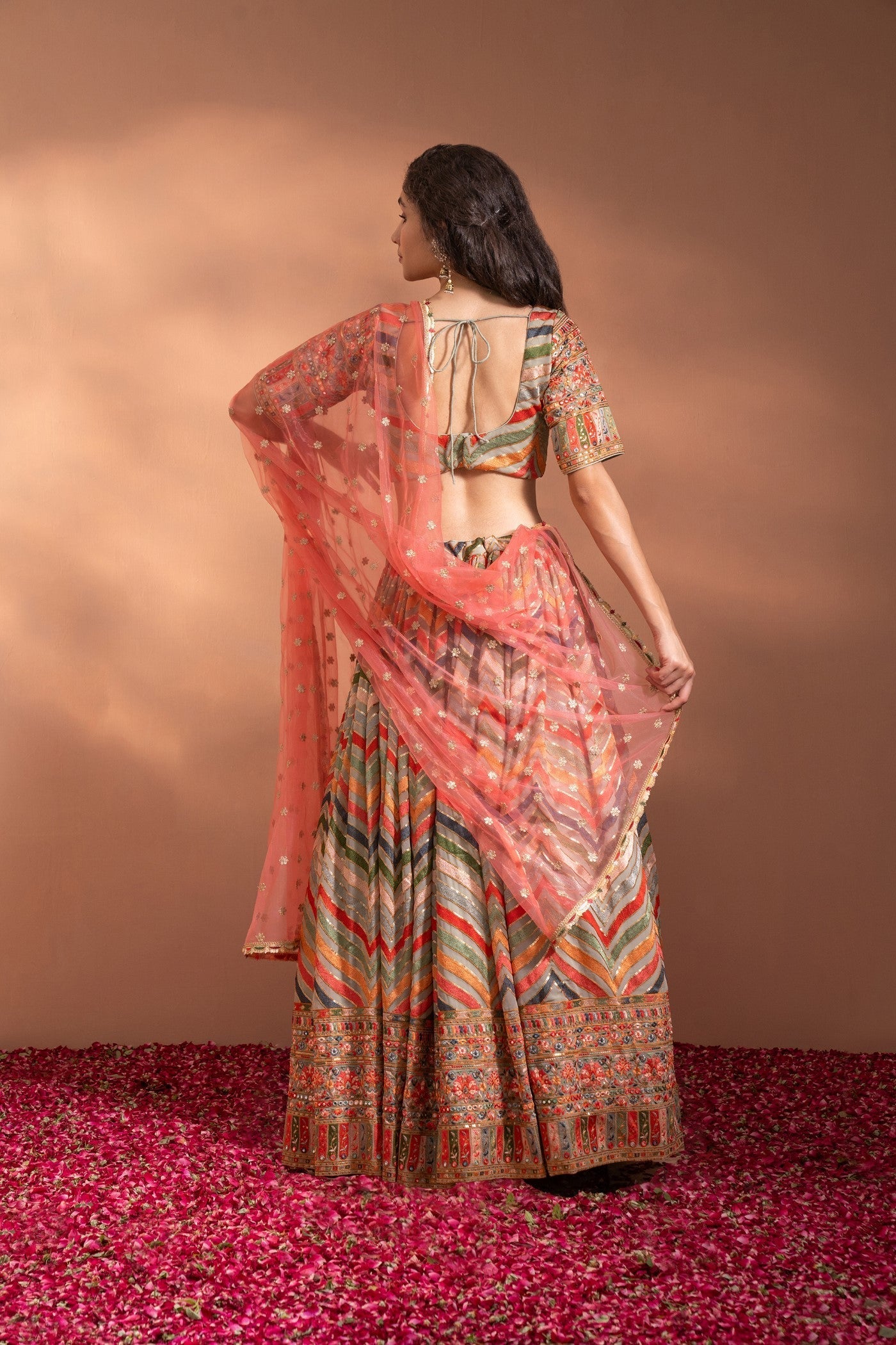 Multi Colour Lehenga set in Cotton-Satin Fabric with heavy threadwork, sequence, arri work & Net Dupatta.
