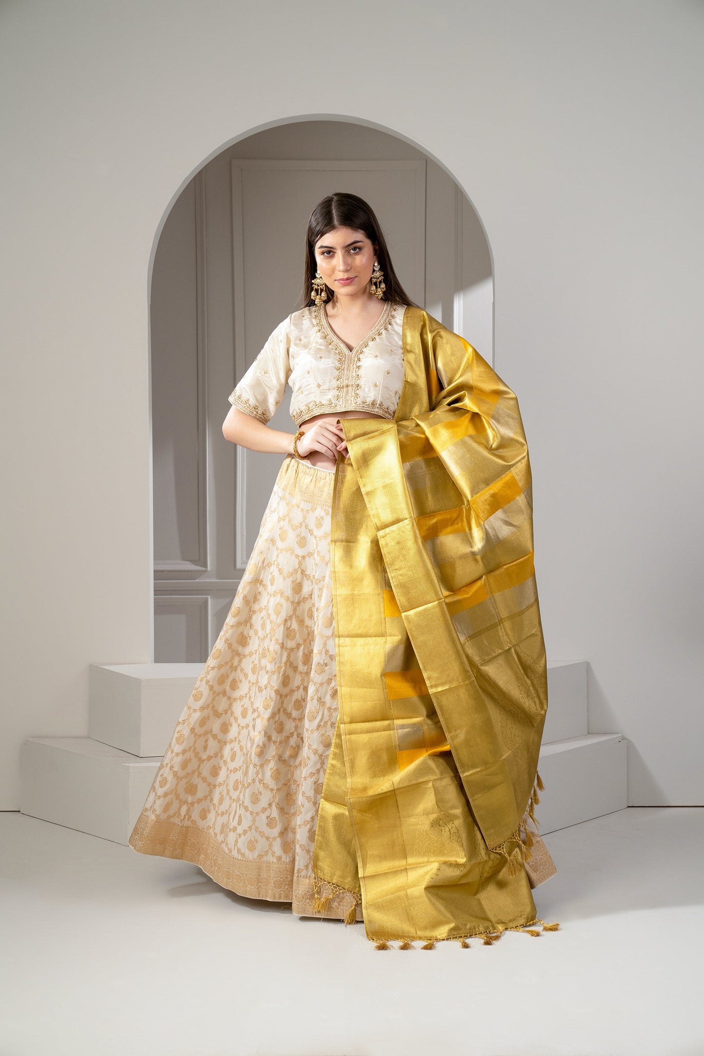Sunglow Golden And Beige Banarasi Silk Zari Embroidered Lehenga Set.