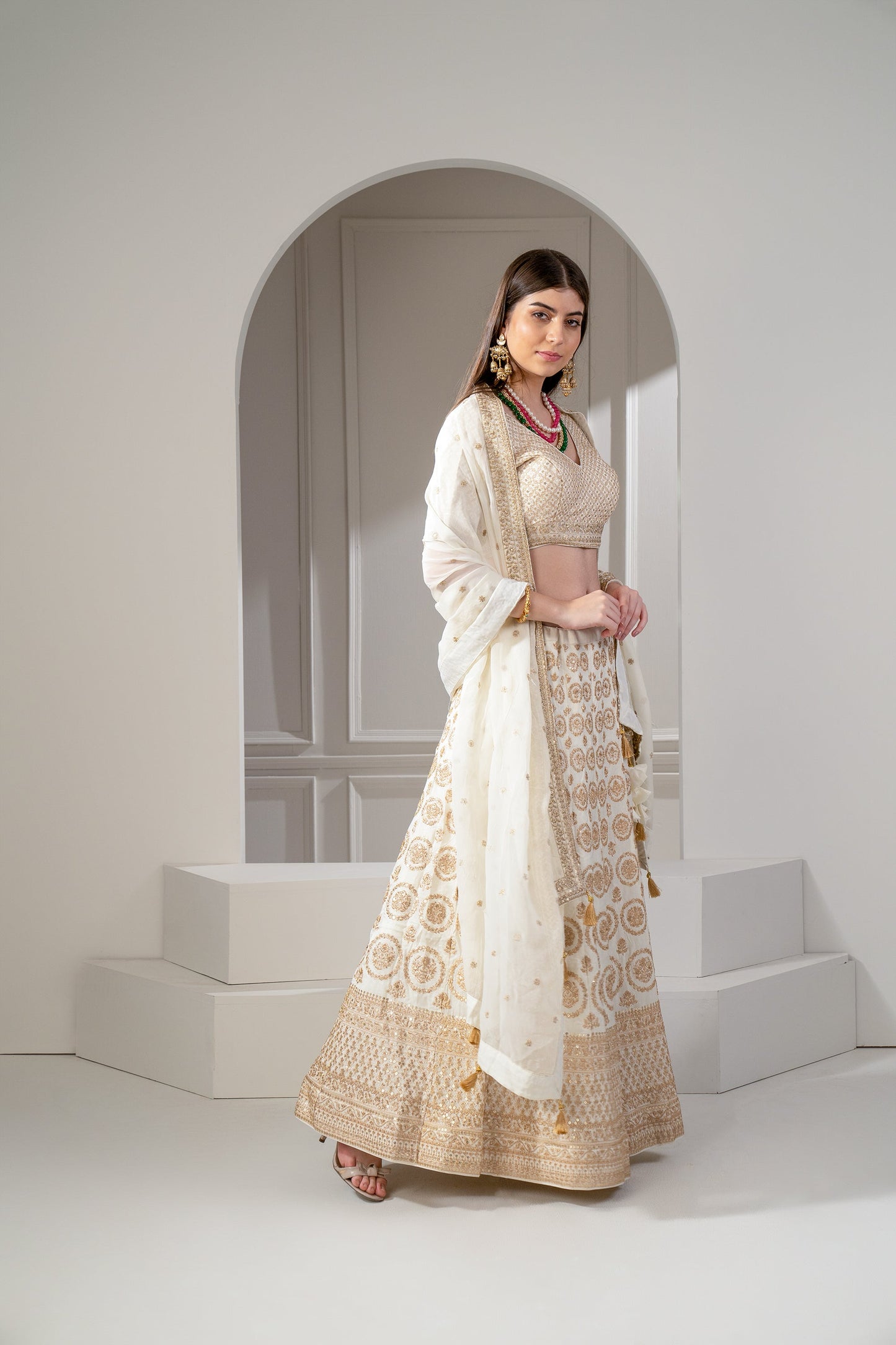 Metallic Gold Organza Silk Sequinned Lehenga Set.