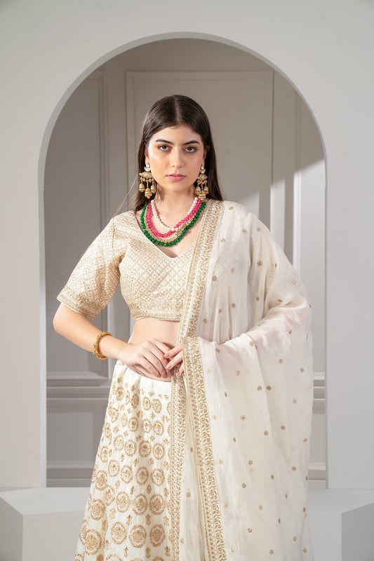 Metallic Gold Organza Silk Sequinned Lehenga Set.