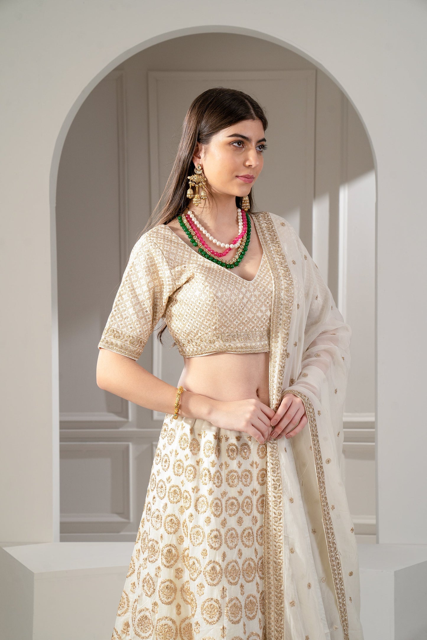 Metallic Gold Organza Silk Sequinned Lehenga Set.