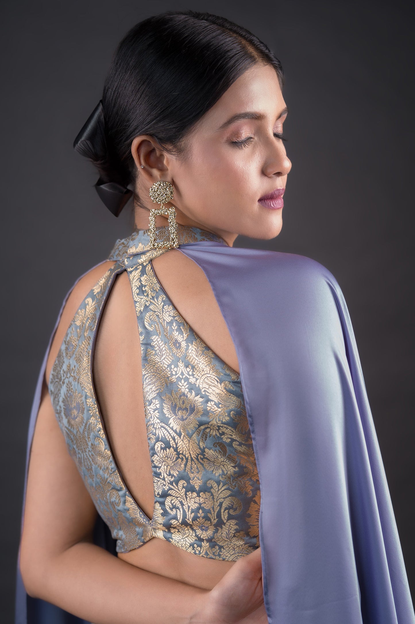 Steel grey ideal brocade crop top paired with Cigar pants