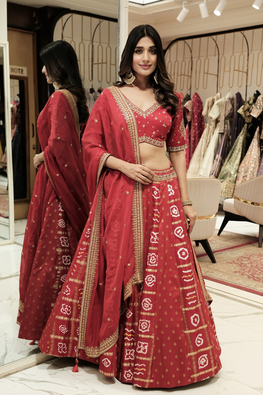 Red silk lehenga choli with mirror and pearl work